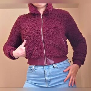 GUESS Faux Fur bomber jacket. Zip up. Fully lined. Size Small. Eggplant/ Purple.